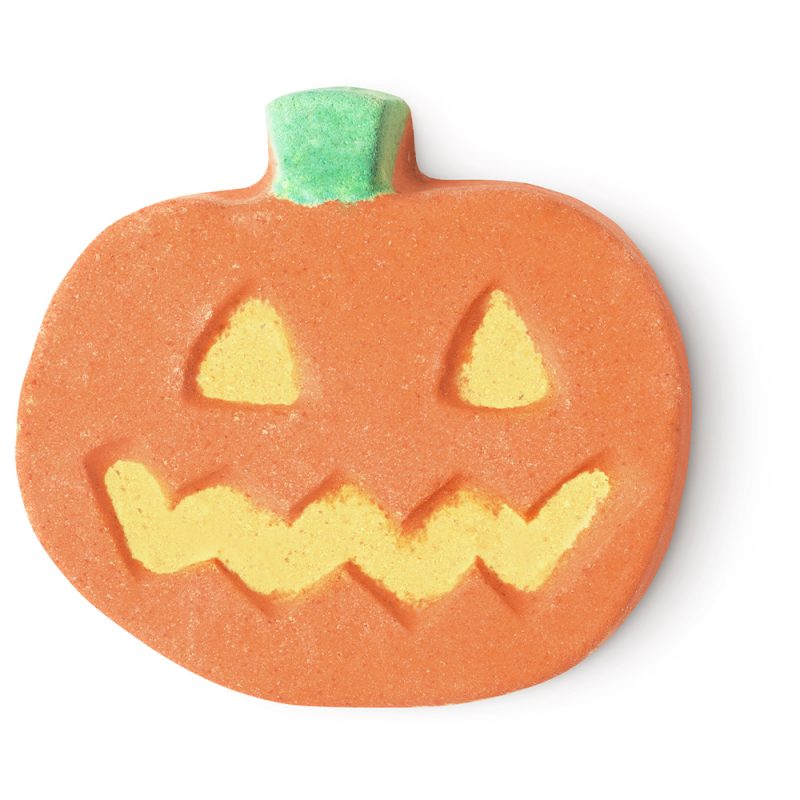 Punkin Pumpkin bath bomb, a jackolantern with orange face, yellow eyes and mouth and a green stalk.