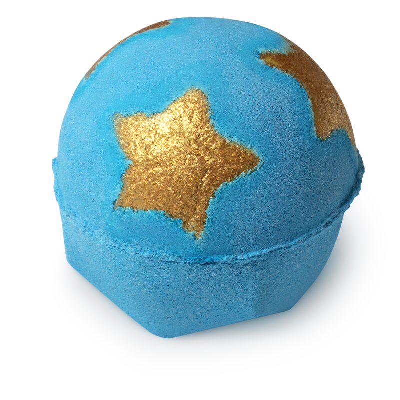 Shoot for the stars, a dark blue bath bomb, round in shape, with three golden stars on the top half.